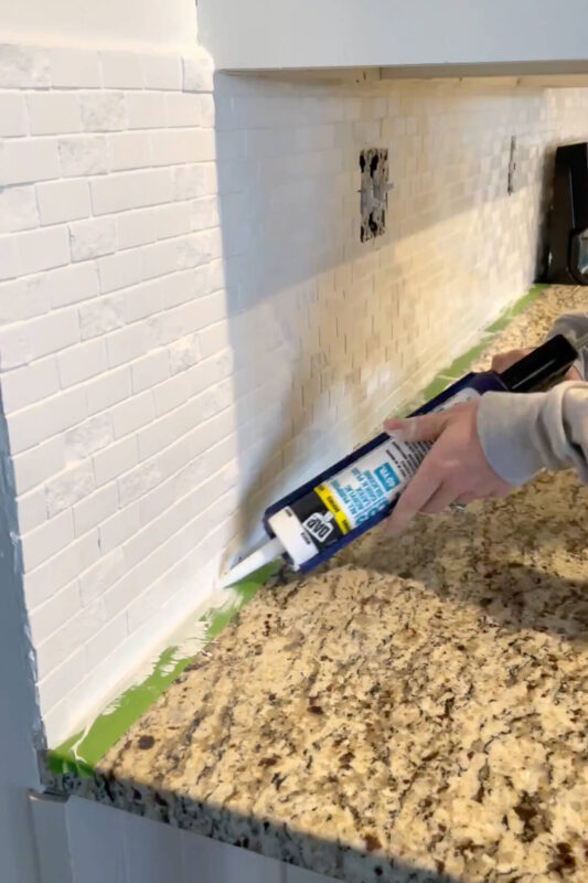 Painting a tile backsplash.